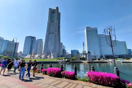 Walking along the Minato Mirai waterfront promenade with the Landmark Tower skyline