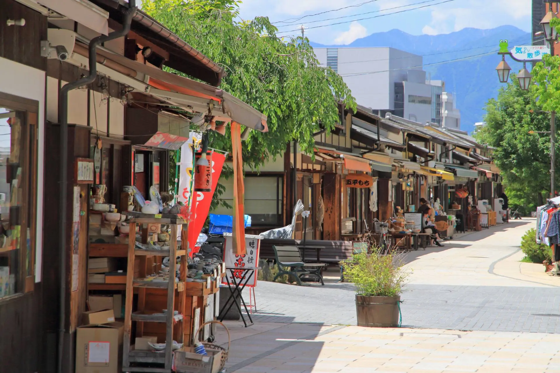 Frog-themed shops and stalls lining the old town shopping street of Nawate in Matsumoto