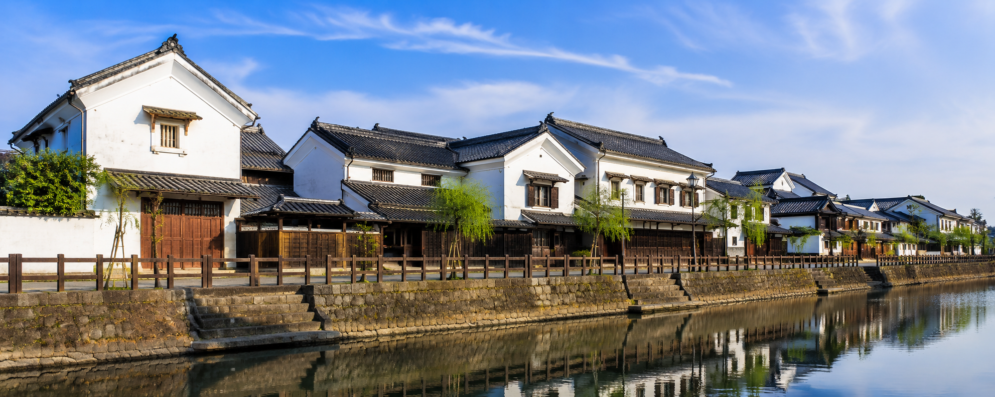 White-walled Edo-period kura warehouses lining the Uzuma River in Tochigi's Little Edo district