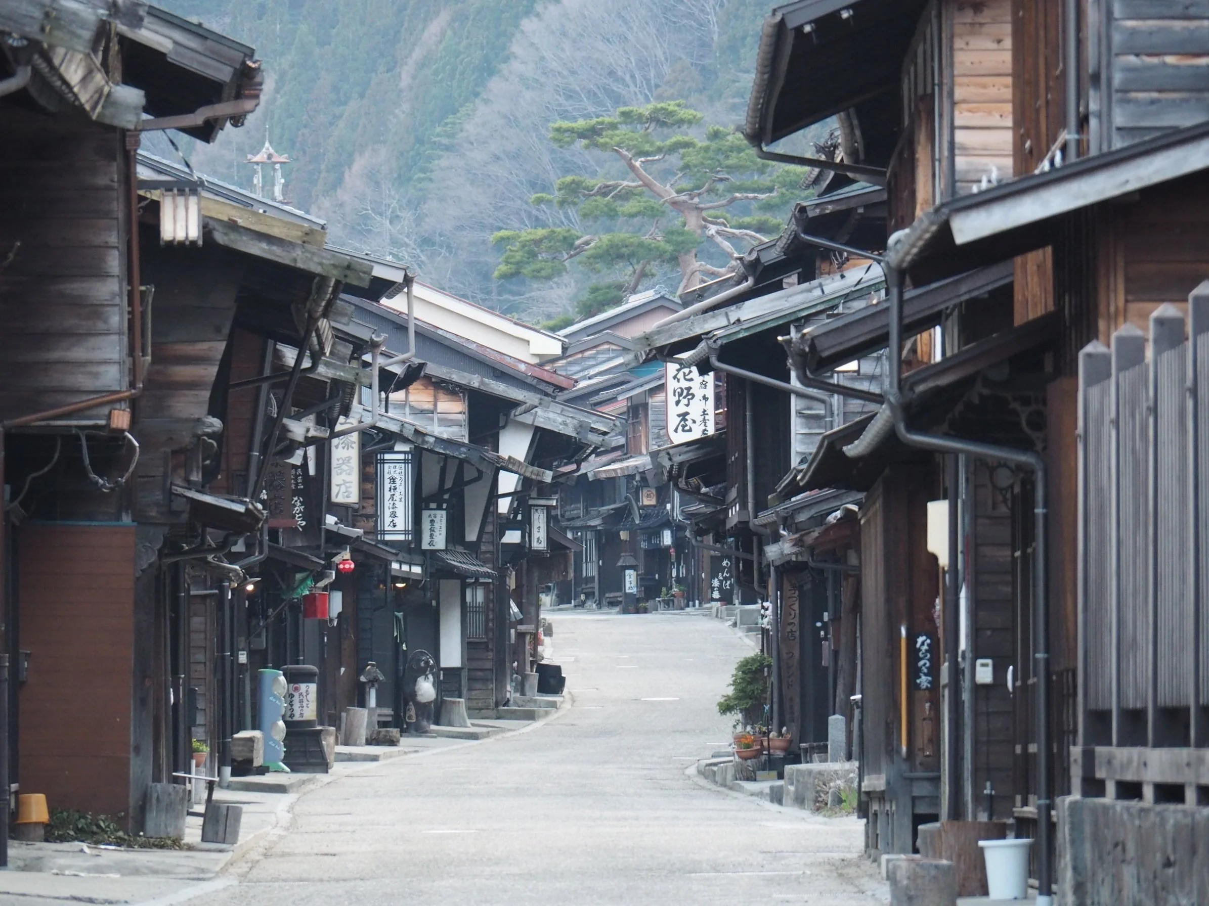Preserved Edo-period wooden buildings lining the main street of Tsumago in the Kiso Valley